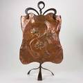 English arts and crafts hammered copper firescreen with raised floral decoration on wroughtiron tripod stand early20th c unmarked 31 x 18 x 9 12