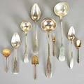 Continental silver servers 19th20th c ten pieces six austrohungarian or russian large ladles or spoons four small and ornate french parcel gilt utensils 268 ot largest 12 14