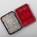 Nathaniel mills silver castle top card case birmingham 1841 front and reverse depict views of castle raised among scroll and floral chasings inscribed mm ogden in original burgundy leather and