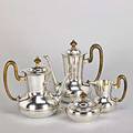 Fourpiece italian 800 silver coffee service vaseshaped coffee pot teapot and cream pitcher with upswept ebonized wood handles bulbous covered sugar bowl with bead and scroll handles ca 1950 57