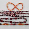 Five art deco bakelite bead necklaces ca 1920 faceted oblate and fancy shaped beads in colors of cherry and honey amber largest bead 30 mm longest 36