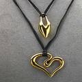 Two 14k gold pendants by robert lee morris hollow modern forms on black ribbon heart 1 78 dropform 1 12 42 dwt 65 gs