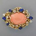 14k gold coral diamond lapis pendant ca 1970 salmon colored oval coral cabochon 24 x 165 mm pearshaped lapis and nine circular cut diamonds approx 65 ct tw 14k yg 139 dwt 1 58 x