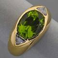 18k yellow gold peridot and diamond ring oval peridot 10 x 7 mm and two triangular diamonds approx 30 ct tw 41 dwt size 6