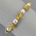 Tiffany  co 18k yellow gold pearl bracelet 2003 continuous line of leaf links and pearls integral clasp 155 dwt 7 12