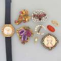 Gold or silver jewelry watch an opal nine pieces 19th and 20th c rococo enameled gold brooch with spinels jeweled gold cornucopia foilbacked amethyst gold brooch two gold bails pearl horsesh
