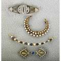 Four 14k gold brooches ca 1900 diamond and platinumtopped monogram aom approx 30 ct seed pearl crescent krementz sapphire and pearl crescent sapphire bow 93 dwt largest 2 18