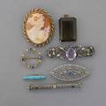 Seven pieces gold or silver jewelry 19001960 14k gold pearl and sapphire circle brooch two 14k wg filigree brooches enameled 14k gold handy pin shell cameo and 14k gold brooch with seed pearls
