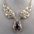 Substantial silver amethyst necklace mid 20th c hand wrought in the arts and crafts style two dropshaped panels suspend pearshaped panel set with a large marquiseshaped amethyst 935 gs 19