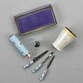 Guilloche enameled silver accessories ca 1900 opalescent and gilt vodka cup by marius hammer germany cylindrical manicure case with roses and blue translucent enamel containing three matching imp