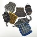 Eight beaded crochet evening bags 19101930 includes glass and cut steel examples longest 9 12 beyond fringe losses and damage