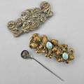 Two art nouveau sash ornaments and a hat pin two sash ornaments and a homeric silver hat pin ca 1900 metal and silver longest 4 34