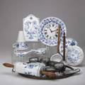 Blue onion twentyeight pieces 19th20th c  rolling pin clock table trivets funnel two oval trays twelve coasters three implements and four small dishes various marks and ages