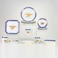 Chinese export style assembled set of dinnerware with eagle motif including punch bowl twenty cups twentyone saucers twelve luncheon plates two shellform plates three cutcorner square dishes