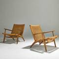 Hans wegner carl hansen and son pair of lounge chairs denmark 1960s oak and woven seats and back foil label to one each 28 12 x 27 12 x 29