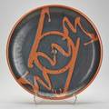 Studio pottery charger black and orange glaze in the japanese folk tradition marked 2 58 x 18 34 dia