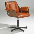 Modern swivel armchair 1970s walnut chromed and enameled metal and leather manufacturers label 32 x 32 x 27