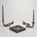 Tony kulish three polychrome decorated ceramic pieces two snake shaped candlesticks and realistic looking ashtray filled with cigarette butts all signed ashtray 1 x 7 12 sq
