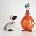 Italian two figural glass pieces pelican and clown decanter pelican signed illegibly larger 16 x 9