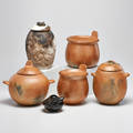 Native american ceramics six pieces including four micaceous bean pots two by aurora sanchez one margaret tryillo and one h lujan together with shirley brauker acorn lidded vessel and paty queza