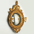 Gilt girandole mirror with flame finial supported by dolphins early 19th c 37 x 27 x 8