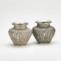 Indopersian pair of silver vases with floral repousse decoration ca 1900 23 ot unmarked each 4 18