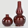 Bernard moore etc double gourd vase in red flambe glaze stokeupontrent england ca 1910 together with similar squat vase both marked doublegourd 7 34 x 3 12 dia