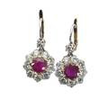 Fine burma ruby and diamond earrings circular cut faceted rubies approx 1 cts each centers bordered by brilliant cut diamonds approx 2 cts tw platinum topped gold for pierced ears mid 20th c