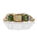 Retro gemset gold wristwatch square watch with gold dial marked for herberts pery swiss 17 jeweled unadj movement emerald cut green tourmaline shoulders approx 11 cts tw diamond accents