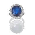 943 cts sapphire and diamond platinum ring oval faceted blue sapphire 1405 x 1243 x 592 mm framed by full cut diamond melee 121 cts tw weights inscribed in hoop size 6 34 77 dwt