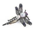 Victorian jeweled dragonfly brooch naturalistically rendered in silver topped 14k gold wings and abdomen set with rose cut diamonds sapphire cabochons ruby eyes two pearls form thorax 93 x 96