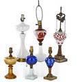 Continental table lamps seven five composite oil lamps one vaseline lamp and one opaline lamp all electrified 19th20th c tallest 17