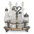 Georgian silver plated castor set cut glass bottles within a silver plated holder 19th c 9 12 x 9 x 8