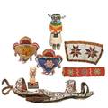 Native american beaded objects seven two woodland indian pin cushions two plains indian panels and a horse bridle together with two hopi kachinas early 20th c largest 21
