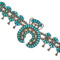 Zuni squash blossom necklace sterling silver with high quality turquoise and twelve blossoms per side early 20th c 28