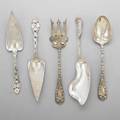 Five ornate silver serving utensils two strawberry pie servers pair of salad servers fish slice 20th c recasts longest 11 12 287 ot