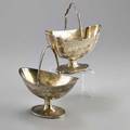 Two english sterling swing handled sugar bowls ogee shaped by henry chawner london 1790 boat shaped by henry holland london 1865 longest 6 12 1589 ot