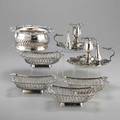 Sheffield silver plate seven pieces four cushionshaped wirework baskets with cast rococo rim 6 58 x 4 18 pair of chambersticks with detachable bobeche and snuffer 7 14 across handle retic