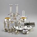 Assorted small silver accessories for the table twentyeight pieces twosided candy dish 8 34 eight saucers 2 34 pair of candlesticks 6 14 four saltpepper shakers 5 14 toast holder