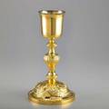 Continental silver gilt communion cup smooth cup on chased baluster column and dome foot depicts religious symbols and fruits of the harvest french 19th c 10 34 1165 ot