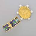 Gold tone jewelry by michaela frey two pieces hinged cuff with egyptian revival enameled design 7 gold tone brooch with freshwater pearls and embossed mythological motif after elizabeth locke