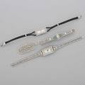 Ladies art deco platinum or white gold jewelry four pieces two diamond dinner watches with white dials and arabic numerals one rectangular longines 18k wg case with diamond rows and 14k wg filigree