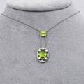 Edwardian diamond peridot and seed pearl lavaliere 14k yg platinum topped millegrained laterally set rectangular peridot approx 18 cts suspends oval peridot within seed pearl and diamond quat