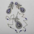 Edwardian marcasite and enameled silver parure designed as ribbon bows suspending articulated royal blue enameled pendeloques pendant 2 14 on fetter link chain with seed pearl and enameled statio