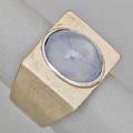 Star sapphire 14k white gold modernist ring semi transparent light blue oval star sapphire approx 10 cts bezel set in rectangular field size 6 12 table of ring 34 x 12 119 dwt