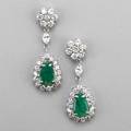 Emerald and diamond white gold drop earrings circular cluster diamond surmount and marquise cut diamond link suspend pear shaped emerald diamond cluster emeralds approx 21 cts tw diamonds appro
