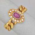 Flexible ruby and diamond 18k yellow gold ring oval ruby cabochon and single cut diamond cluster joins curb link band italy ca 1985 marked italy size 7 46 dwt