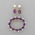 Amethyst and pearl 14k gold brooch and earrings oval wreath brooch with prong set deep purple amethysts and post set seed pearls marked 14k unidentified maker cypher 1 38 x 1 34 cultured pear