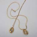 Two joseph wolf 14k yellow gold pendants oval forms accented by two cultured pearls and sapphires on delicate 14k yg rope chain white gold topped bead set diamonds approx 08 ct tw on gold fi