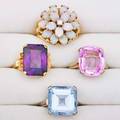 Four gold and gem set rings three 10k yellow and white gold birthstone rings possibly synthesized square topaz size 8 rectangular amethyst size 7 oval pink sapphire size 7 12 14k yg opal